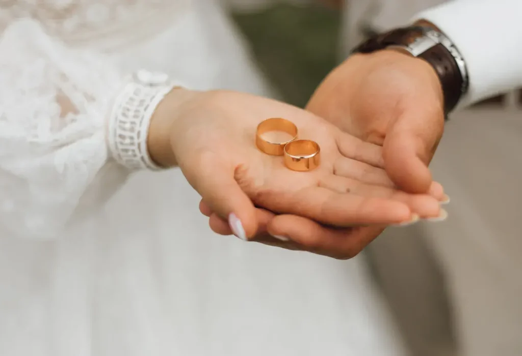 golden-bands-hands-groom-bride